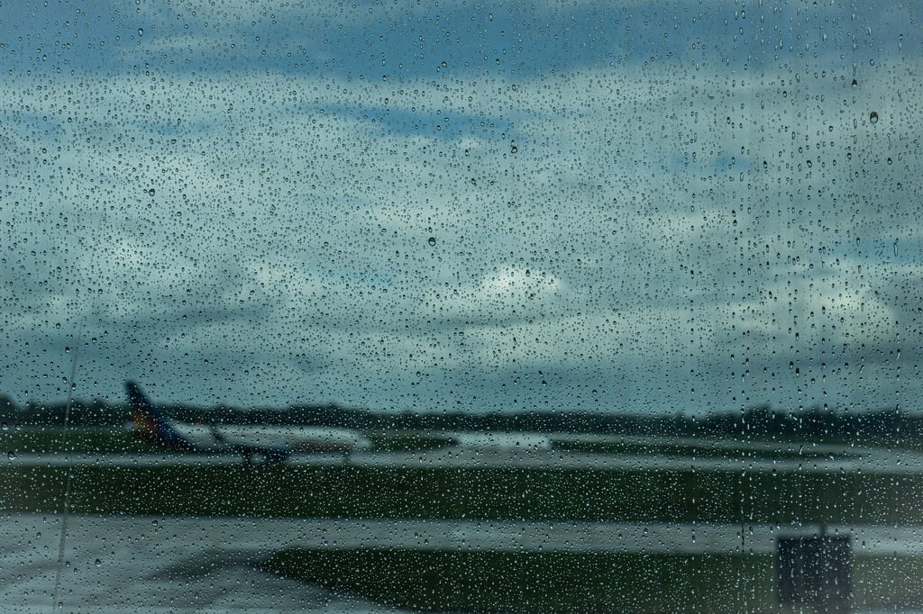 rainy airport terminal umbrella - Can You Carry an Umbrella on a Flight in India?