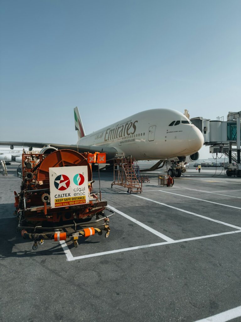 Emirates A380 aircraft at Dubai International Airport gate — DXB layover guide