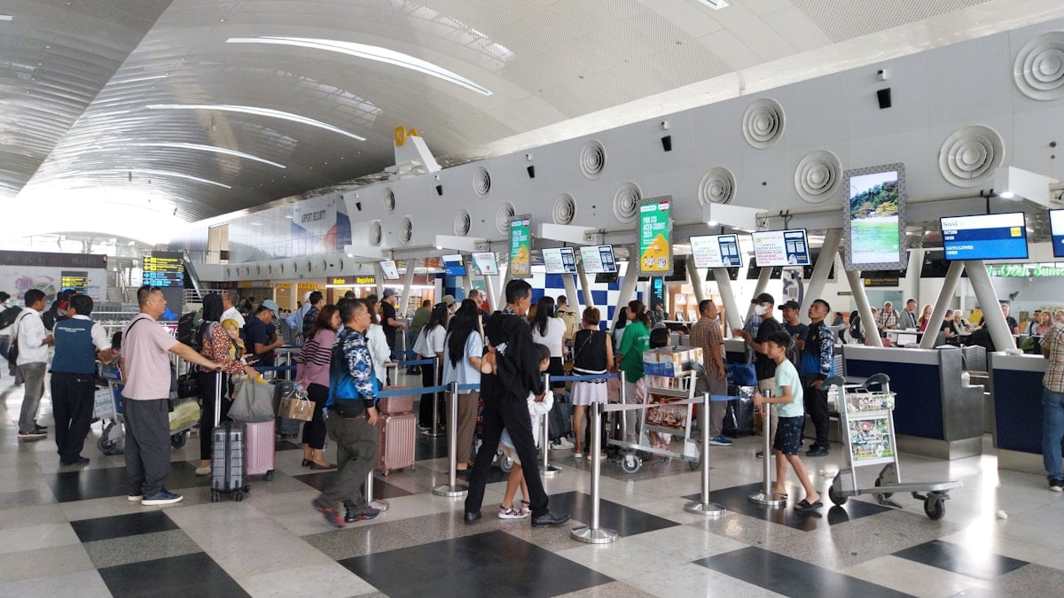 Passengers at airport check-in counter